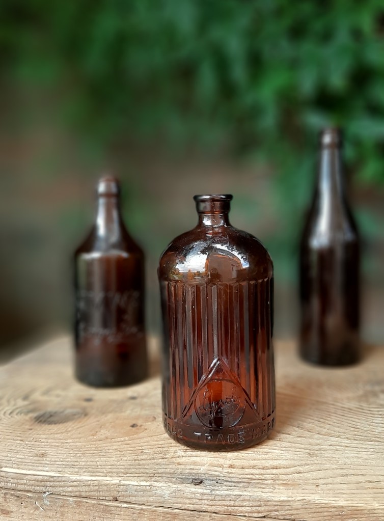 Vintage amber bottle vases for hire in Scotland