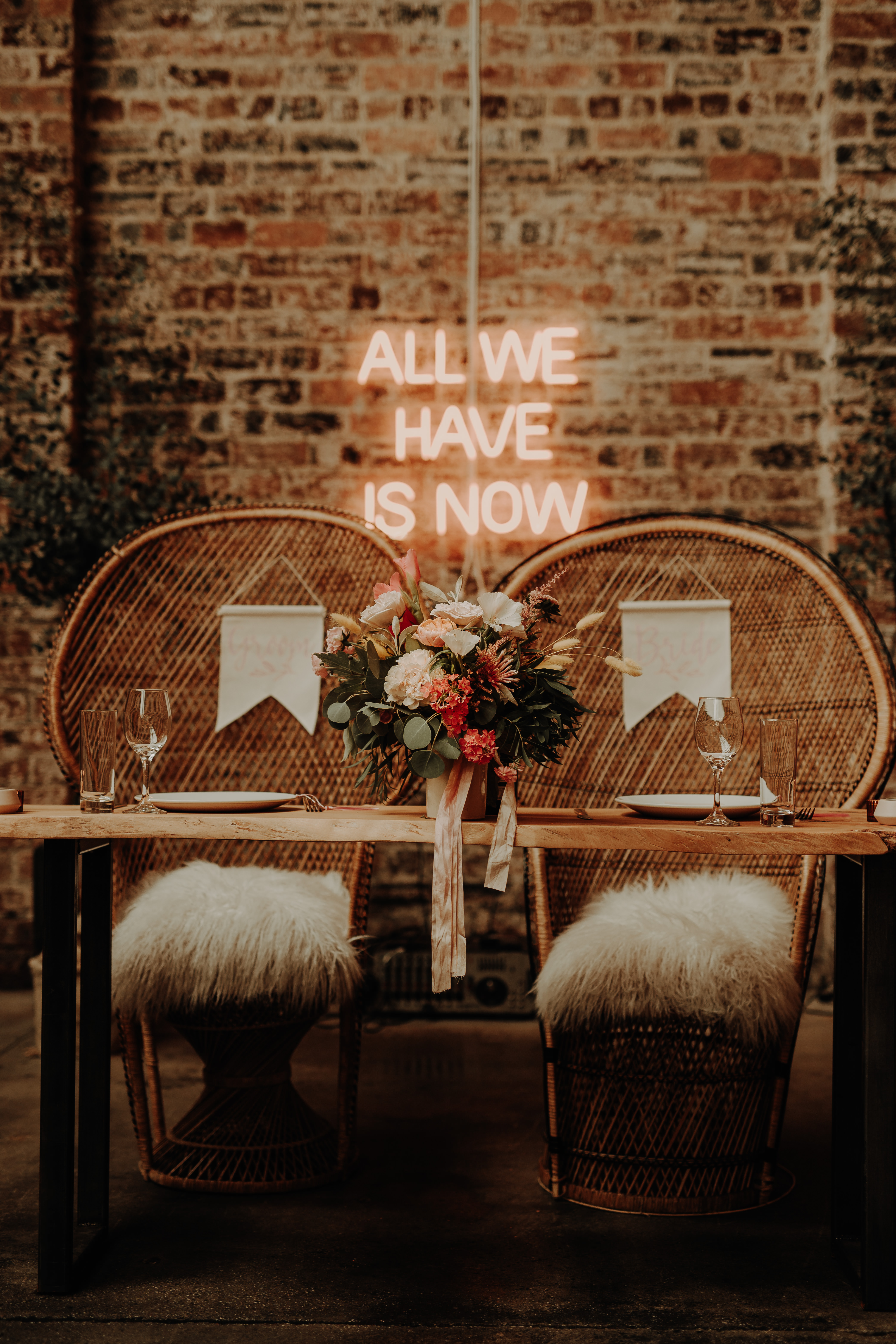 Modern top table with Peacock chairs and neon sign in Dundee Scotland