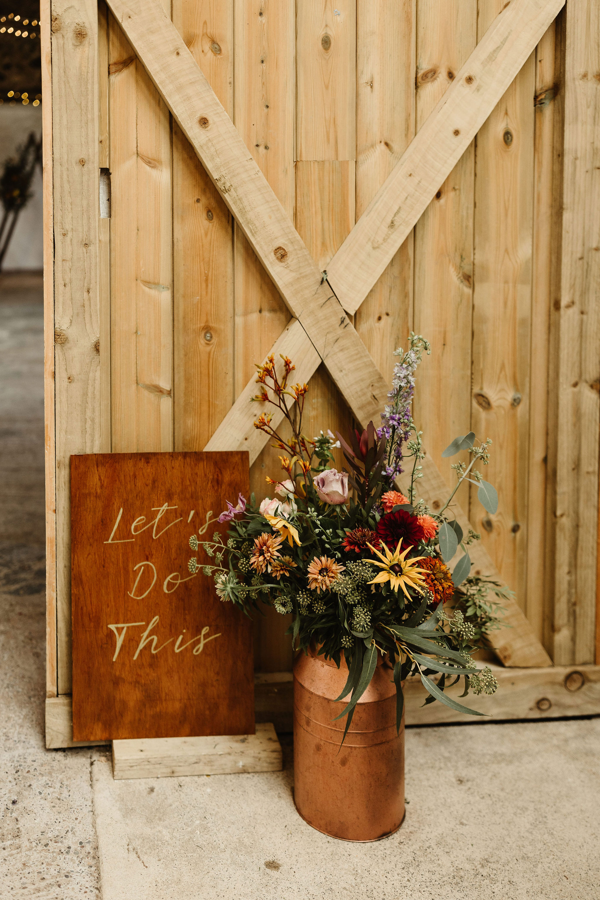 modern wedding signs in Cow Shed Crail in Fife Scotland with copper churn